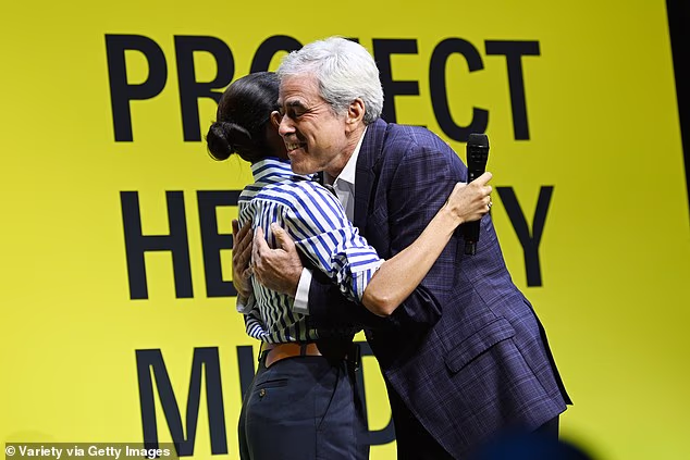 Jonathan Haidt hugs Meghan Markle at Project Healthy Minds' World Mental Health Day Festival held in New York on October 10