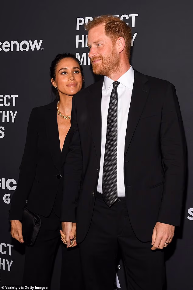Meghan and Prince Harry are seen together on the red carpet before being handed Humanitarian of the Year awards