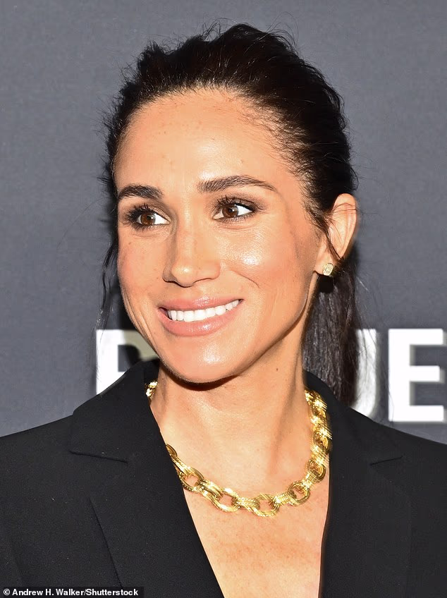 The Duchess of Sussex beamed in front of the cameras