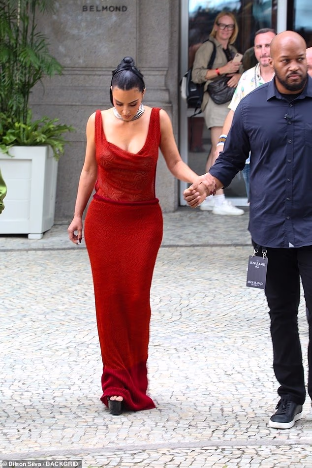 Kim Kardashian, 45, struggled to keep her balance as she navigated the cobblestone streets of Rio de Janeiro in Brazil on Tuesday in sky-high stilettos
