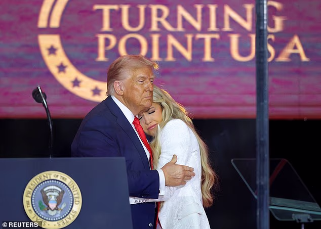 Donald Trump embraces Erika, during a memorial service for her husband at State Farm Stadium in Arizona in September