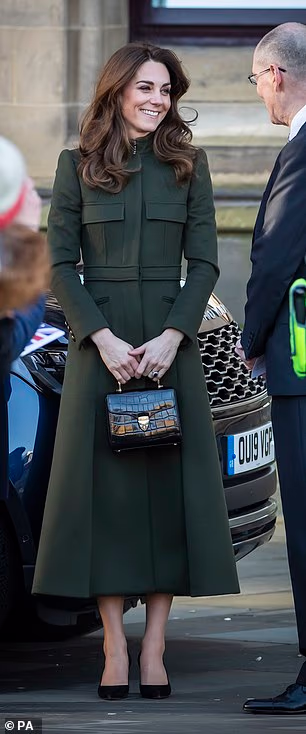 She carried a crocodile-effect Aspinal bag during a visit to Bradford in 2020