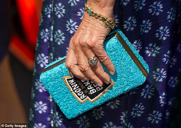 Royal fashion watchers were delighted when they noticed Camilla's handbag - a sequinned clutch emblazed with the Heinz baked beans motif by British label The Rodnik Band - during a 2015 appearance in London