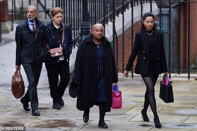 A photograph taken on a previous occasion of Doreen Lawrence, the mother of murdered Stephen Lawrence, arriving at court with Anjlee Sangani (right), who used to be her solicitor