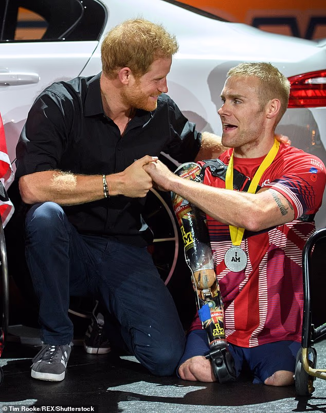 Harry is pictured at the Invictus Games in Toronto in 2017 in another image shared by Meghan