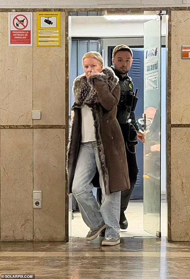 Catherine Ommanney, 53, was held on Sunday afternoon on suspicion of fraud after a hotel manager reported her to police in the morning. Pictured: Ommanney at court in Palma