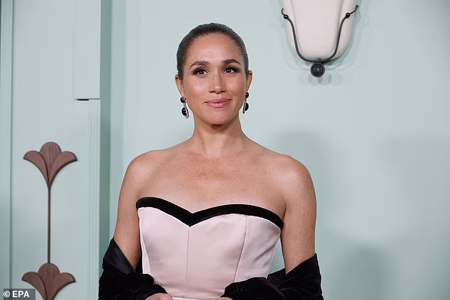 The Duchess of Sussex posed on the red carpet in Los Angelesco-ordinating the billowing sleeves of the train with her earrings, shoes and sweetheart neckline