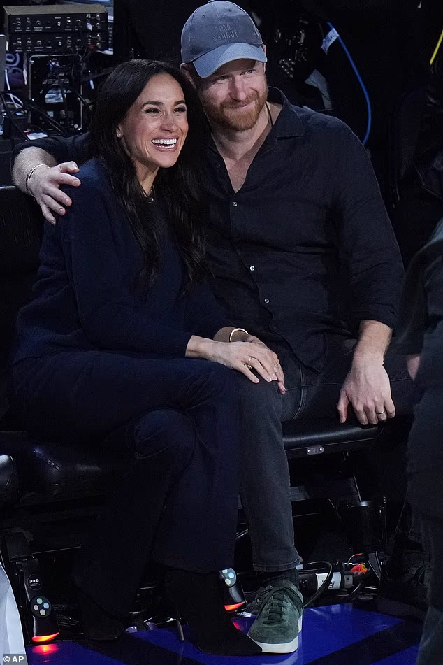 Meghan tucked herself into her husband's side as they beamed for the NBA media