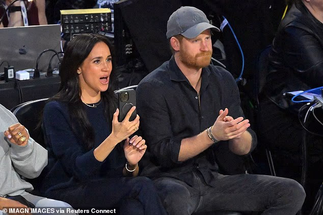 The Duchess of Sussex appeared particularly engrossed in the action as she let out a cheer