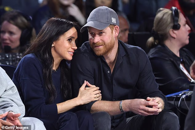 The Sussexes appeared to enjoy a courtside date night as they cozied up to one anoter