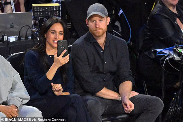 The 44-year-old appeared to be filming the likes of LeBron James on her iPhone