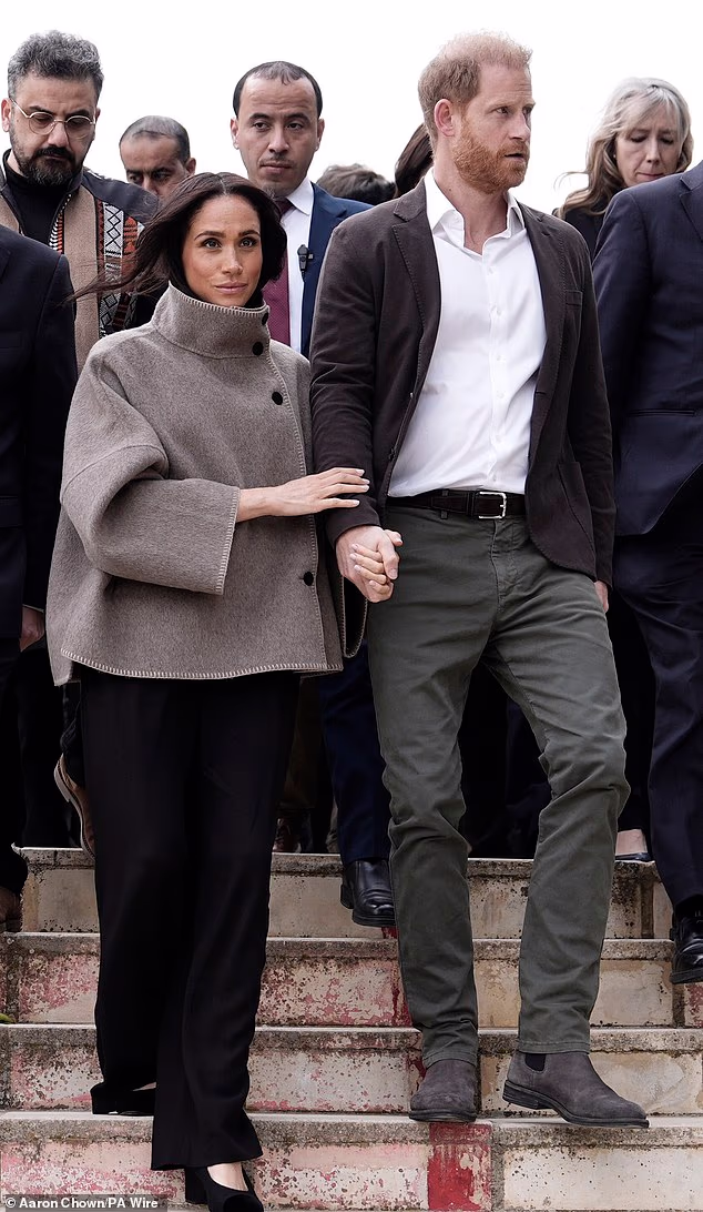 Meghan sported a funnel-neck coat when visiting the National Centre for Rehabilitation of Addicts (NCRA) in Amman, Jordan