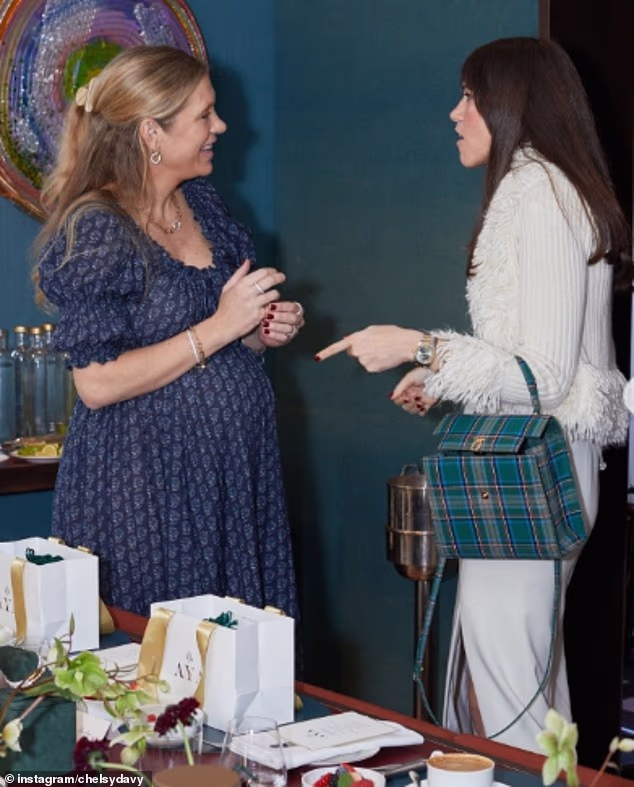 The former City lawyer, 40, revealed her pregnancy in a low-key fashion on Instagram today, resharing photographs of herself and her blossoming baby bump that were posted by her jewellery brand, Aya