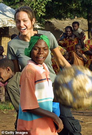 Pictured: Angelina Jolie playing football during a 2003 visit to Tanzania