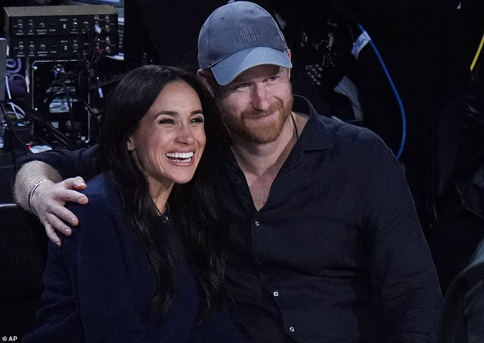 Meghan Markle and Prince Harry stole the spotlight as they snatched courtside seats for Sunday's NBA All-Star Game. The NBA held its 75th All-Star Game weekend in Los Angeles this week, with the league's biggest stars facing off in the main event on Sunday night. And the Duke and Duchess of Sussex had a front-row seat to the action as they were spotted enjoying a date night at the Intuit Dome in Inglewood, California over Valentine's Day weekend. Meghan, 44, cozied up to her husband, 41, as she threaded her arm through his after taking their seats in front of the paint. The As Ever mogul was later spotted stroking Harry's arm to attract his attention, directing him to smile for the NBA cameras.