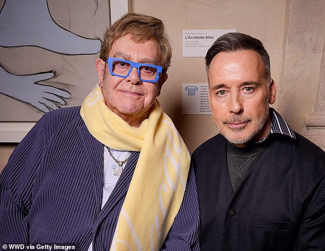 Elton John and David Furnish at Paris Men's Fashion Week in January