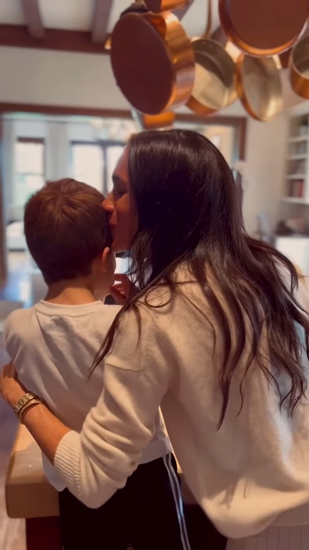 Meghan Markle has revealed she's reading a poetry book about motherhood after receiving it as a gift from her 'mom friend'. She is seen here with her son Prince Archie