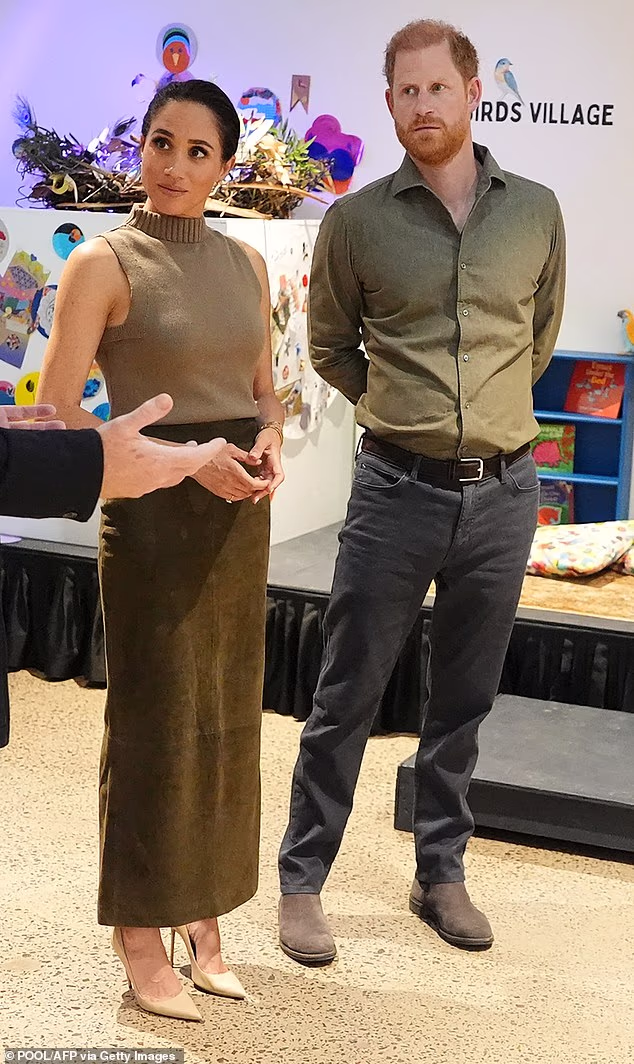 Later in the day Meghan swapped her monochrome look for more laid-back earthy tones as the couple visited the National Veterans Arts Museum