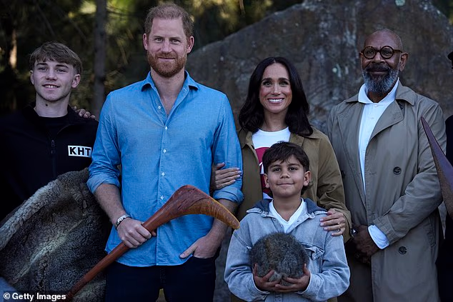 Prince Harry, Duke of Sussex and Meghan, Duchess of Sussex pose for a photo during a Scar Tree Walk as the honoured Aboriginal culture