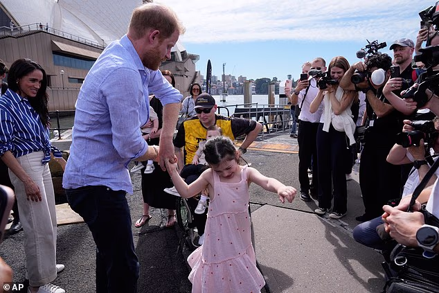The four-year-old spins around with the Duke outside Sydney Opera House