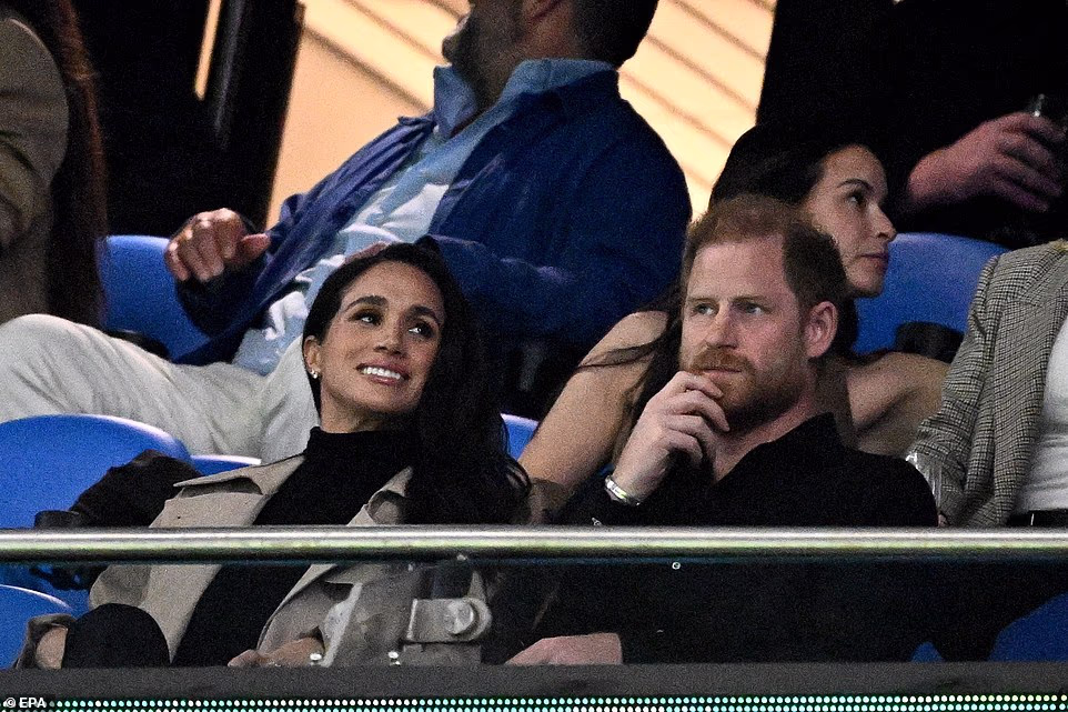 They sat in the VIP section and Meghan smiled as she placed her hand on Harry's knee at the Allianz Stadium as her rugby-mad husband took in the game. Meghan's lucrative meet-and-greet came on a day where the Duke and Duchess of Sussex spoke to and hugged survivors of the Bondi terrorist attack in December. They then sailed around Sydney Harbour at an event to promote Invictus Australia next to the Opera House. As the couple departed the InterContinental Coogee, a young Aussie man rushed at their car armed with a longneck beer bottle and a workman's boot, asking Harry to 'do a shoey' - an Australian tradition where booze is necked from a shoe. A plainclothes police officer forcefully pushed him away, so the man did the 'shoey' himself. VIP tickets for the Her Best Life event at the five-star InterContinental Coogee Beach hotel cost £1,670 and included a group table photo with the duchess. Meghan spoke at the event on Friday on the final day of her trip to Australia with the Duke of Sussex. There was extensive security at the hotel for the duchess's visit, with media access to the event strictly limited.