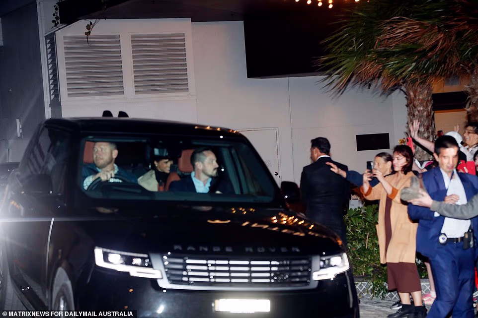 The couple met Shannon Biederman, the museum's senior curator, who said it was 'really special' to have them visit. She said: 'This event has not only changed the Australian Jewish community, but the Australian community at large. 'It (the exhibition) is ensuring that it's not forgotten. 'When we start the memorial, in addition to the three tonnes of flowers that we were able to salvage, there were thousands of other items left – there were plush toys, there were crochet flowers, there were Lego flowers.' Naveed Akram, 24, is accused of 15 counts of murder and one count of committing a terrorist act over the attack in which dozens of people were injured at Sydney's Archer Park in December. New South Wales Police allege Akram and his father – Sajid, 50, who was shot dead by police at the scene – carried out Australia's worst mass shooting since 1996, targeting the Jewish festival of lights. Discussing Harry and Meghan's visit to Bondi, Ms Biederman said: 'I think it's really special and I'm really grateful for them coming out. 'It's been a really challenging time for the community and all of these expressions of unity and support are greatly appreciated.' On Bondi, Harry and Meghan delighted the public as they headed onto the sand, removing their shoes before walking towards the sea on a gloriously sunny morning, followed by an ever-increasing scrum of media and beachgoers who tried to snap selfies with the couple.
