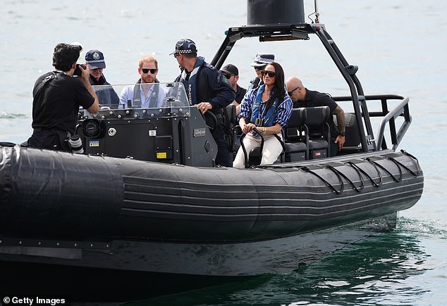 SYDNEY, AUSTRALIA - APRIL 17: A police launch boat takes Prince Harry, Duke of Sussex and Meghan, Duchess of Sussex to a yacht to take part in a sailing event with members of Invictus Australia in Sydney Harbour, on day four of the royal trip to Australia on April 17, 2026 in Sydney, Australia. The Duke and Duchess of Sussex are on a four-day visit to Australia, with engagements across Melbourne, Canberra and Sydney. (Photo by Jonathan Brady-Pool/Getty Images)