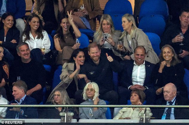 Britain's Prince Harry and Meghan, Duchess of Sussex, gesture as they attend the NSW Waratahs versus Moana Pasifika rugby match at Allianz Stadium, Sydney, Australia, April 17, 2026. REUTERS/Hollie Adams     TPX IMAGES OF THE DAY
