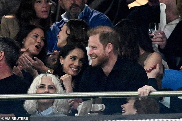 Britain's Prince Harry and Meghan, the Duke and Duchess of Sussex, react during the Super Rugby match between the NSW Waratahs and Moana Pasifika at Allianz Stadium, in Sydney, Australia, April 17, 2026. AAP Image/Dan Himbrechts/ via REUTERS  ATTENTION EDITORS - THIS IMAGE WAS PROVIDED BY A THIRD PARTY. NO RESALES. NO ARCHIVE. NEW ZEALAND OUT. AUSTRALIA OUT. NO COMMERCIAL OR EDITORIAL SALES IN NEW ZEALAND AND AUSTRALIA.