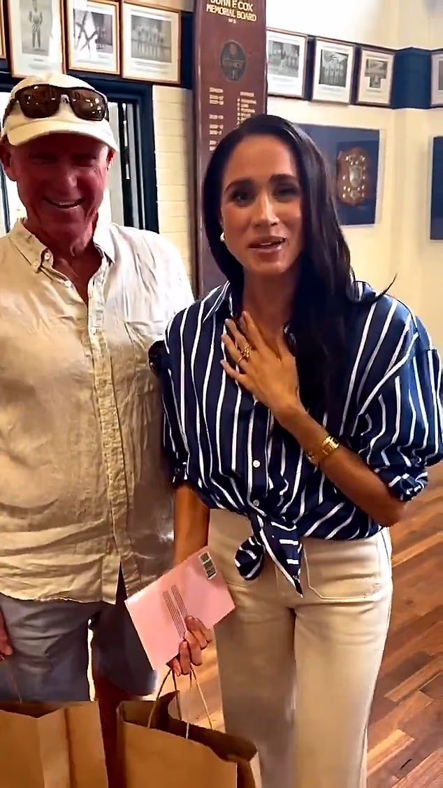 Meghan with local surf lifesaving club president Steve Barnach, who asked the Duchess to film a video message for his daughter
