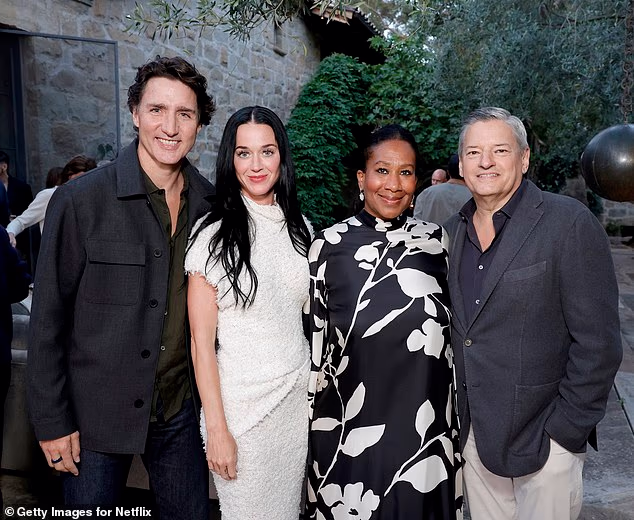 Katy Perry (second from left) brought current boyfriend and former Prime Minister of Canada Justin Trudeau (left) to a star-studded party hosted by Netflix boss Ted Sarandos (right) and wife Nicole Avant (second from right)
