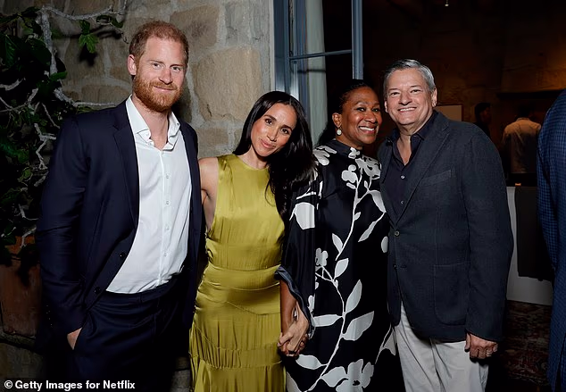 The Duke and Duchess of Sussex pose for a photo with Netflix boss Ted Sarandos and his wife Nicole Avant in Montecito on Friday night