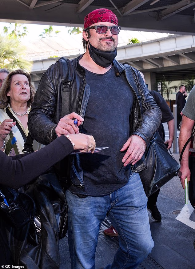 American filmmaker Robert Rodriguez signed autographs for fans after arrving at Nice airport