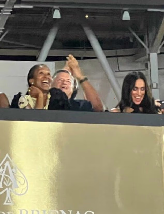 Pictured: Meghan with Ted Sarandos and his wife.