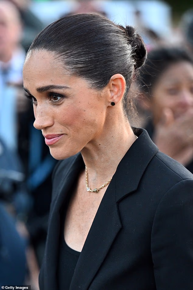 When Meghan, 44, first arrived at the Lost Screen Memorial, her non-verbal cues suggested 'tension, trepidation and even some uncharacteristic nervousness', according to body language expert Judi James
