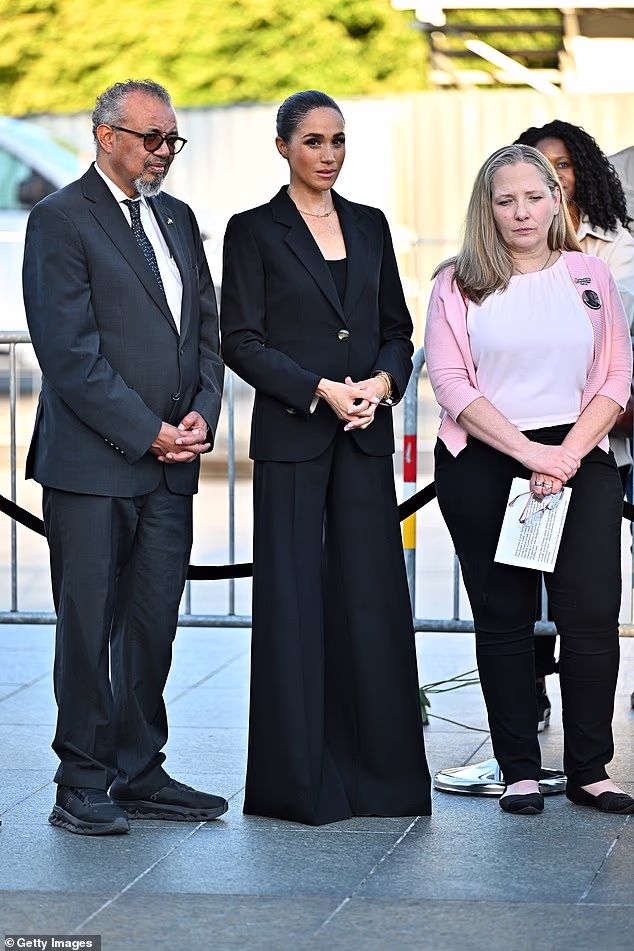 Ms James told The Daily Mail: 'Here she appears to be tense and a little needy, turning her head to exchange a few words as what looks like an act of checking or distraction to break the simple walk to the lectern'