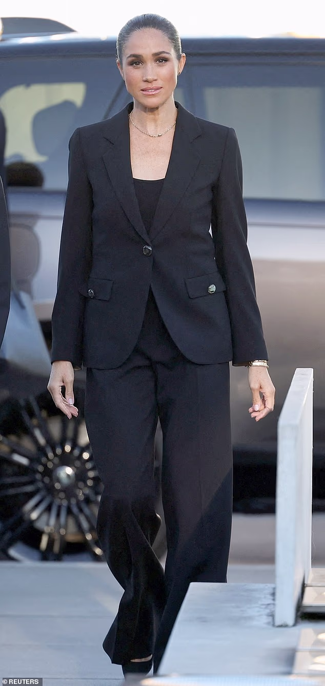 The duchess strode out wearing an all-black suit, including a jacket that appeared in the mirror selfie featuring Lilibet posted on Saturday