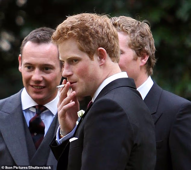 Prince Harry is 'embarrassed about his pre-Meghan life' and 'laddish' behaviour in the army, royal experts have claimed. Pictured in 2009