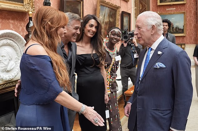 George and Amal turned on the charm as they joined King Charles at a star-studded reception at Buckingham Palace in June 2025
