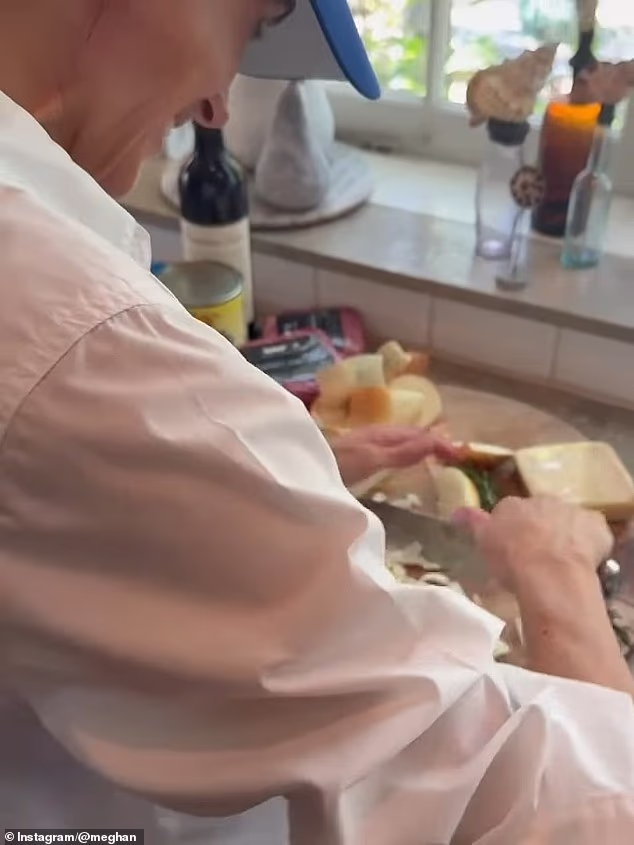 As she chopped up an onion on the cutting board, the camera pulled back to reveal the sole glimpse of her smiling visage from the post