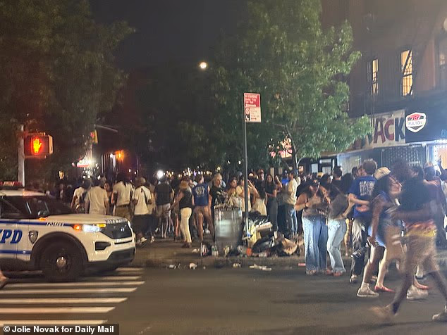 New Yorkers continue to spill out into the streets long into the night