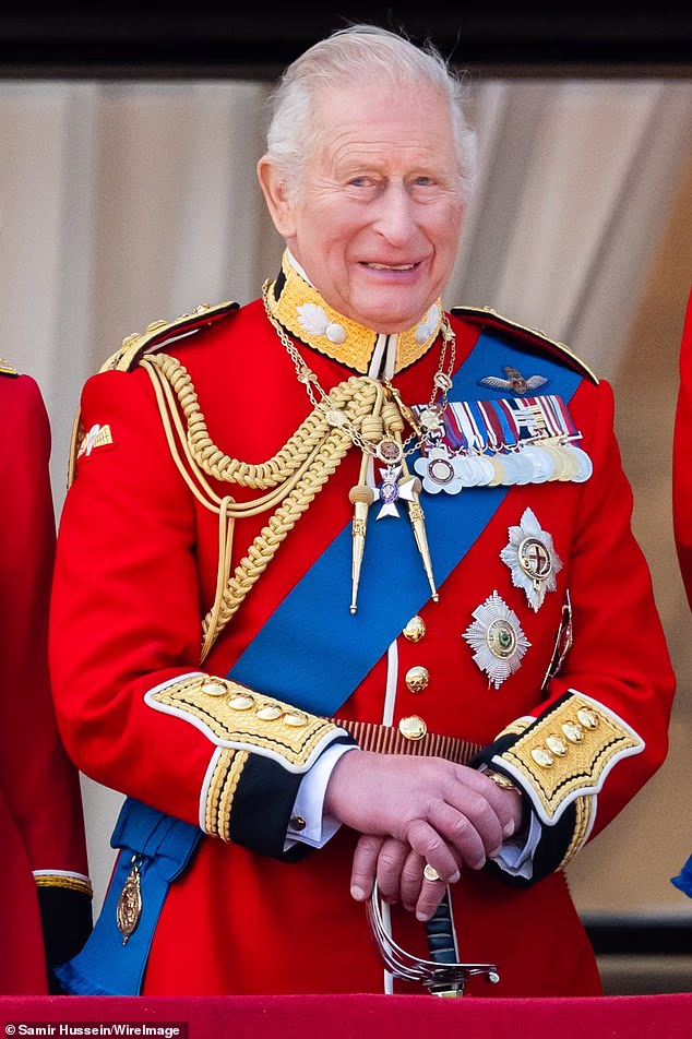 King Charles III watches an RAF flypast from the balcony of Buckingham Palace during Trooping the Colour