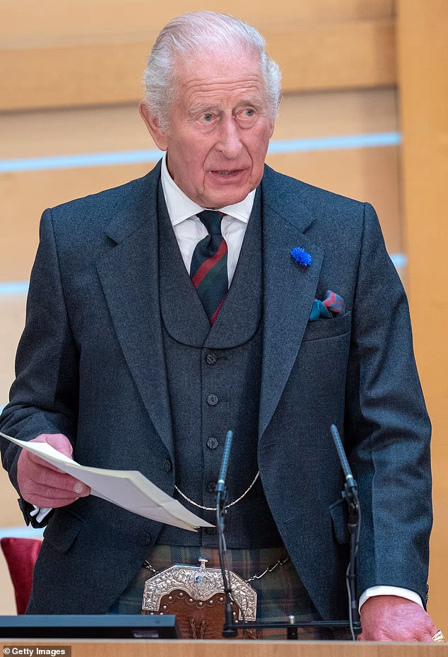 King Charles III opening the Scottish Parliament on Friday.  Harry is said to blame the so-called 'grey suits' around his father for the lack of a new security assessment for his family, not his father himself