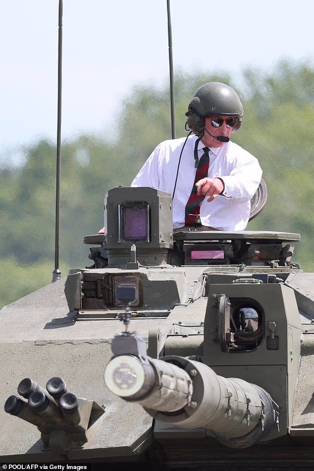 His Majesty was driven twice around a dirt track in a Challenger 2