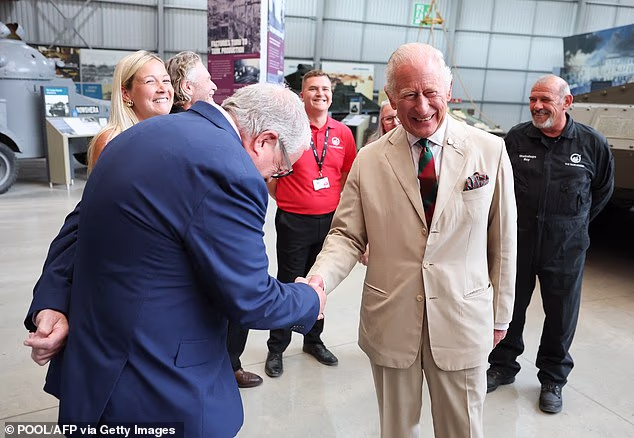 King Charles was all smiles as he met former RTR and museum stuff in the exhibition hall at the Tank Museum