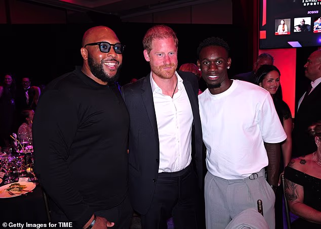Harry is pictured alongside US soccer star Folarin Balogun during the event in New York