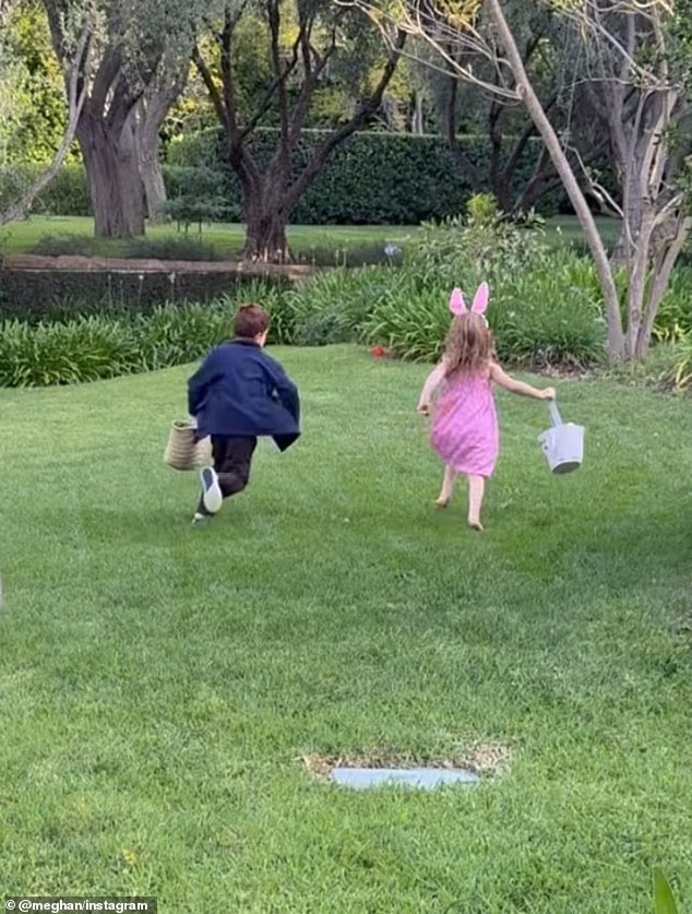 The former Suits actress shared she is trying to foster healthy eating habits in both her children by sending them out to 'pick a nice piece of fruit' after dinner. Pictured: Archie and Lilibet on an Easter egg hunt in one of Meghan's holiday snaps from April
