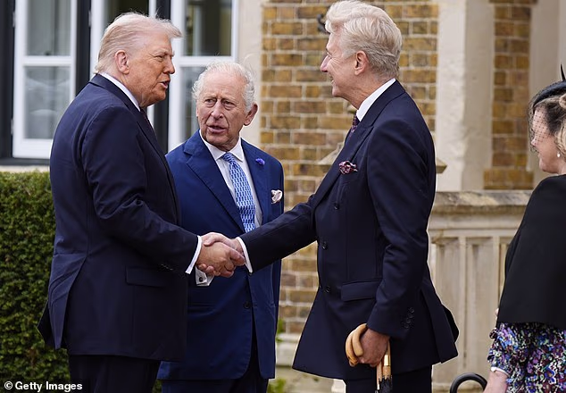 Sir Clive shaking hands with US President Donald Trump at Windsor Castle last September
