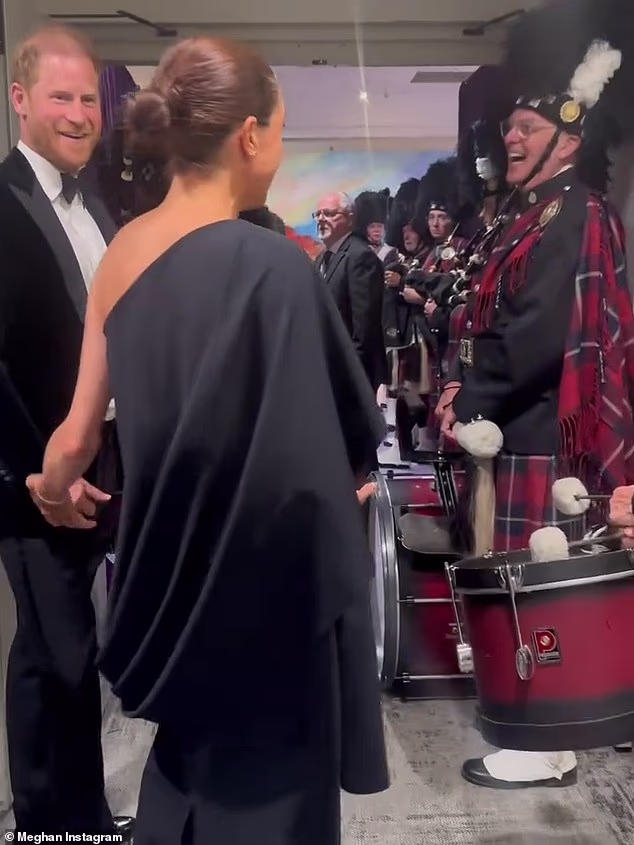 Dressed in a gown by Canadian designer Greta Constantine she quipped to the musicians: 'My husband loves bagpipes!'