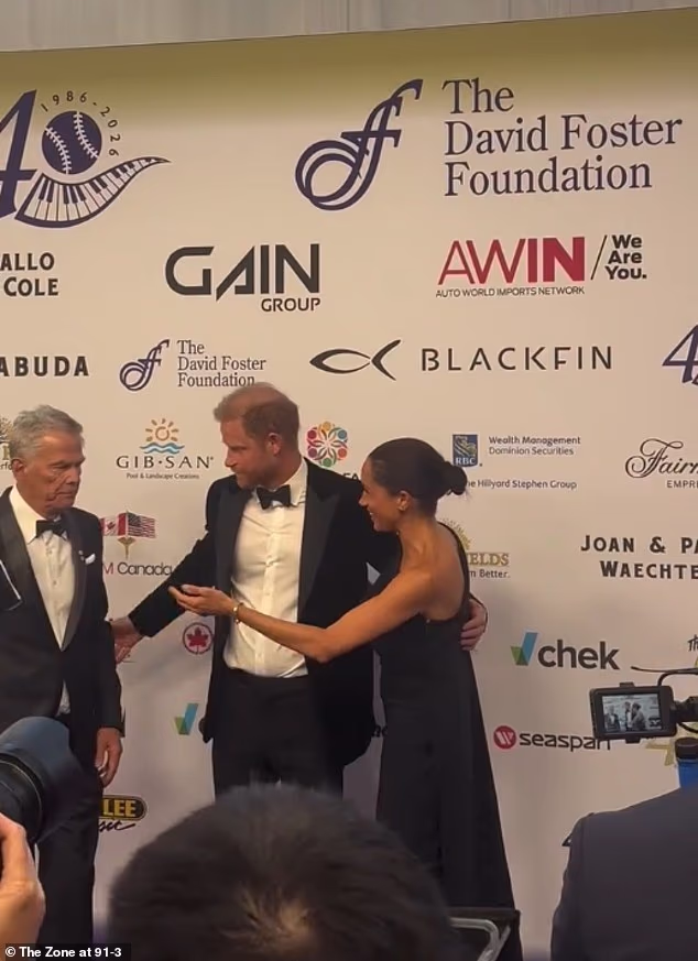 In the viral clip, Foster appeared to completely ignore Markle as she eagerly extended her arm out to greet him on the red carpet before he swiftly walked past her to pose to the left of his much-younger wife Katharine McPhee for a group photo